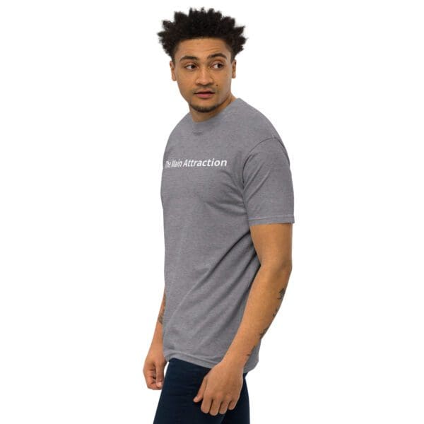 A man wearing a gray t-shirt with the words " love everything."