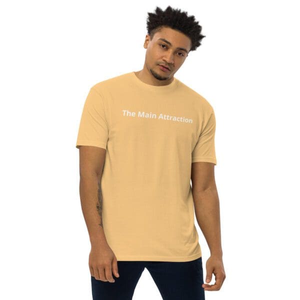 A man wearing a tan t-shirt with the words " the new generation."